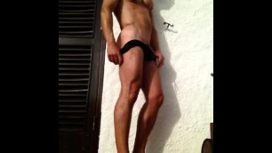 Public Strip on Balcony by Toned, Tanned Muscle Guy.